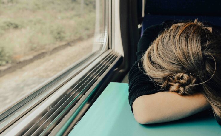 sleeping woman in train at daytime